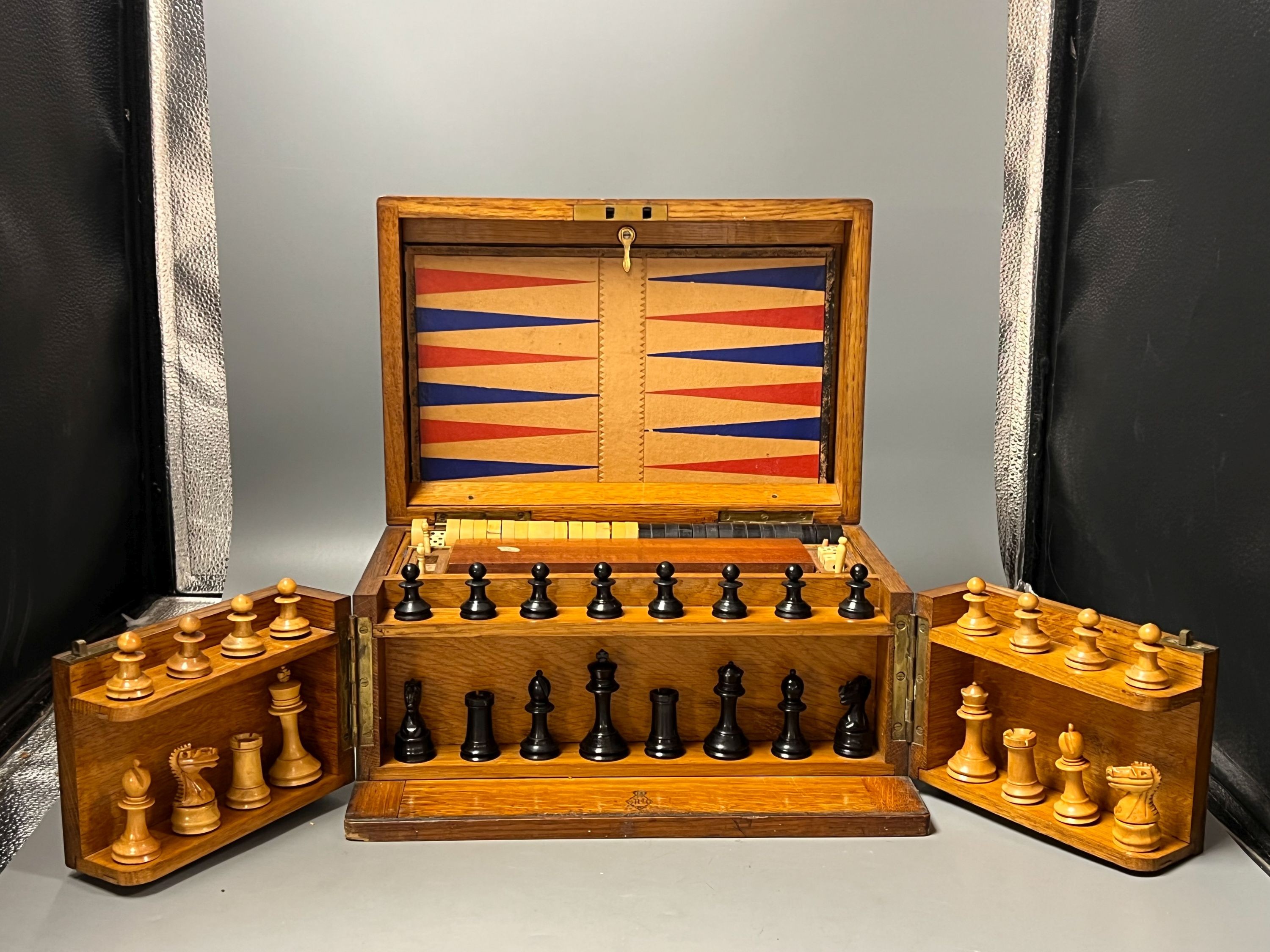 A Victorian oak games compendium, 32cm wide